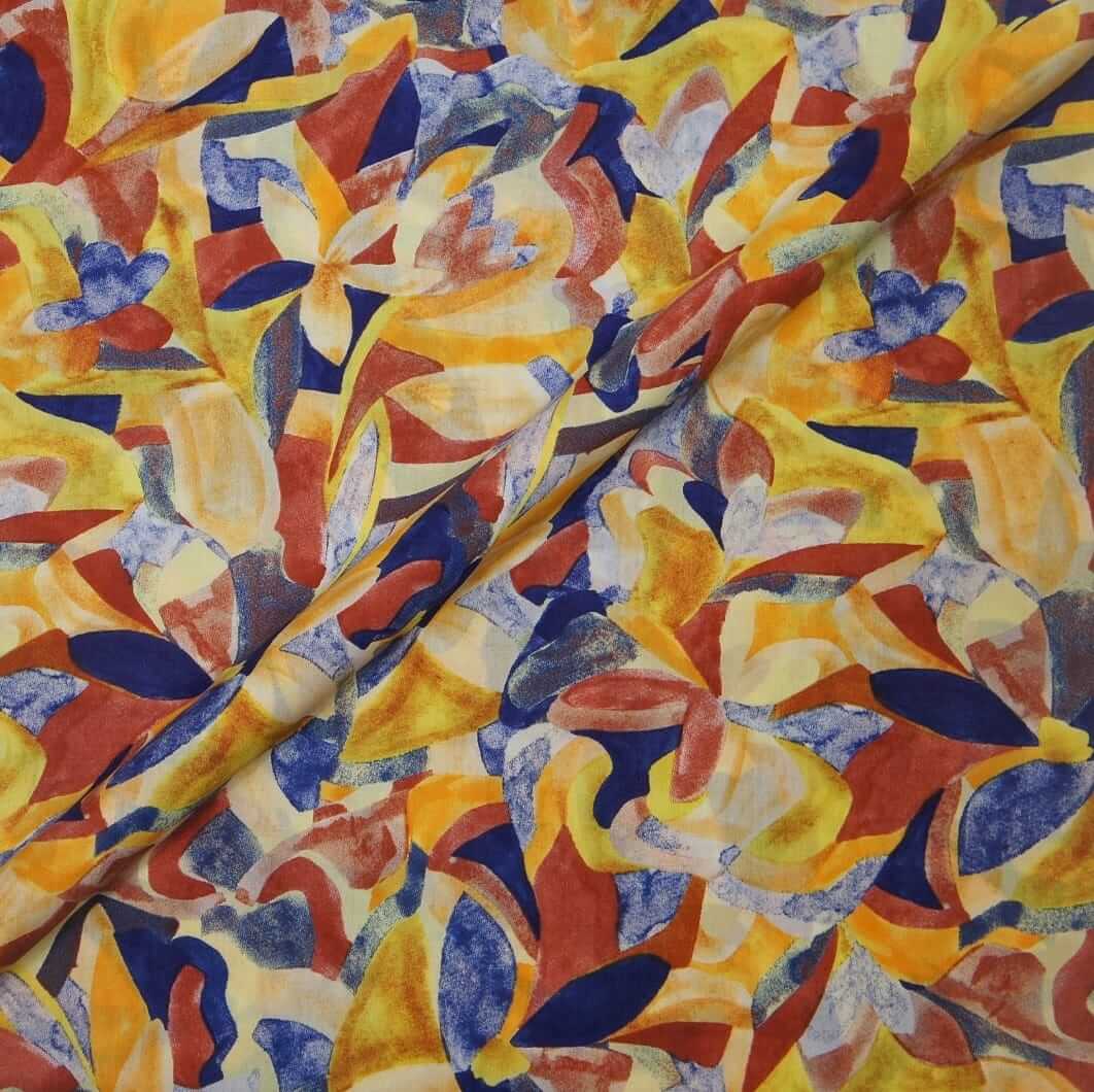 Colorful abstract patterned fabric with red, blue, yellow, and orange colors.