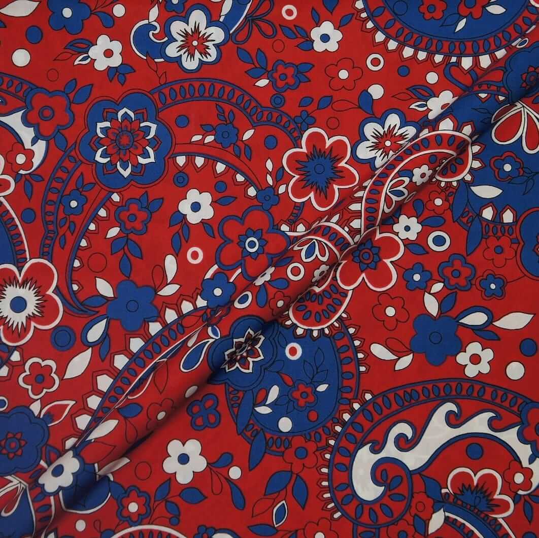 Red fabric with blue and white floral paisley pattern