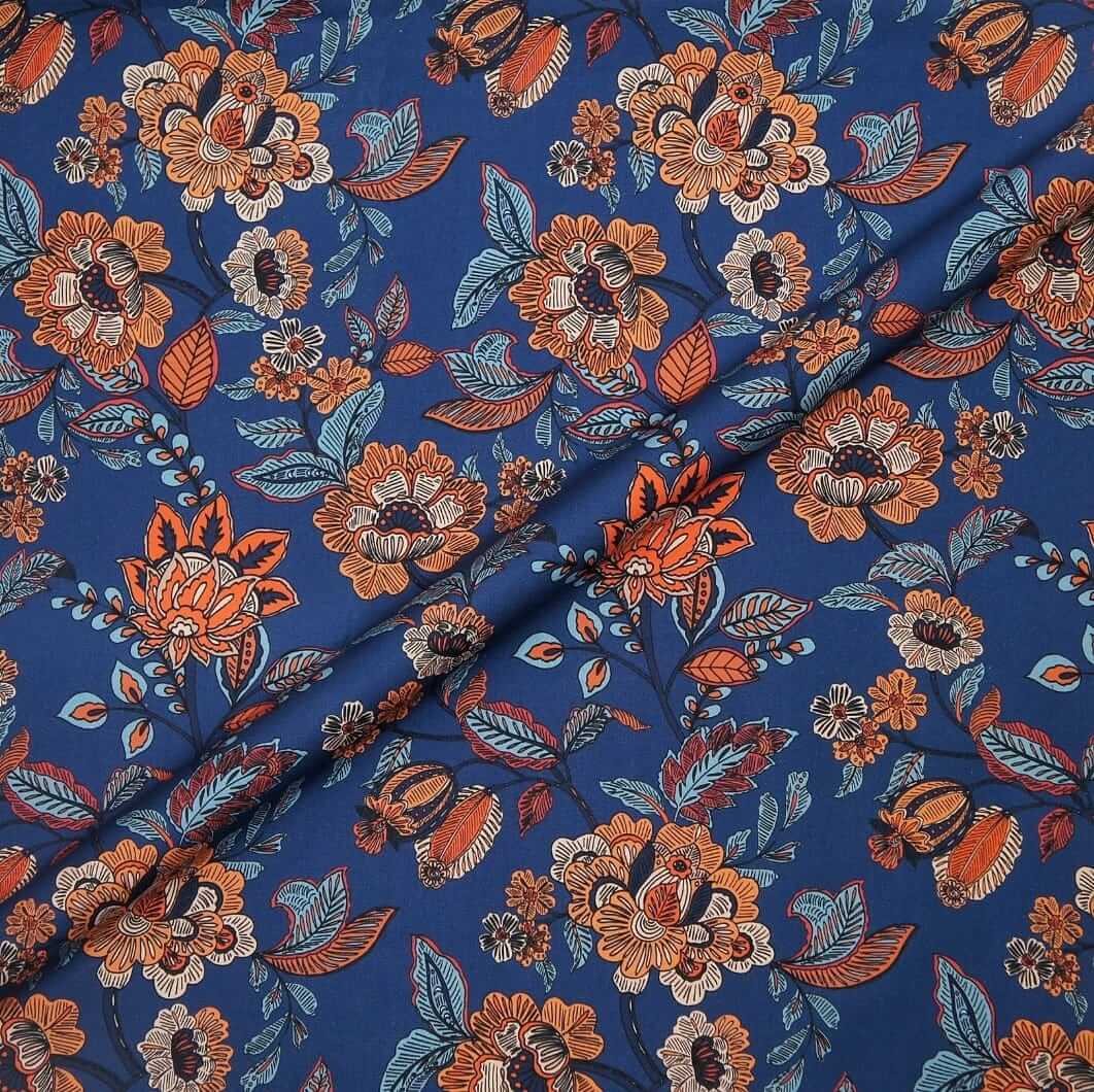 Floral patterned fabric with orange and blue colors on a blue background