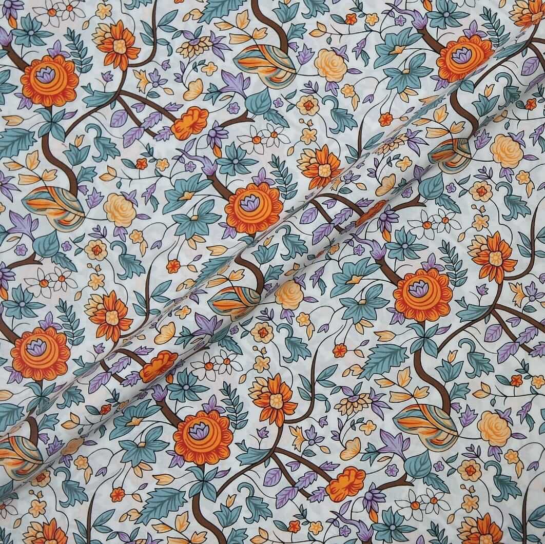 Floral patterned fabric with orange, blue, and green flowers on a white background