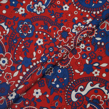 Red fabric with blue and white floral paisley pattern